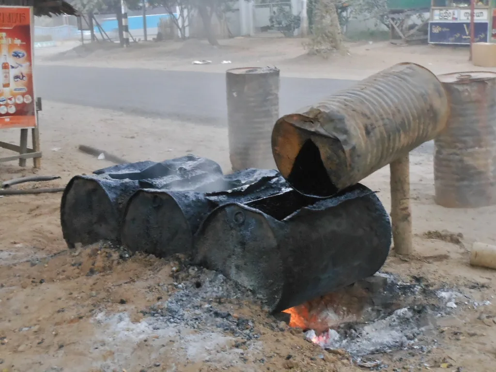 Bitumen material being heated for roadwork